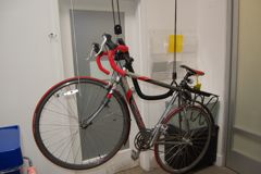 Bike on hooks, ready to hoist